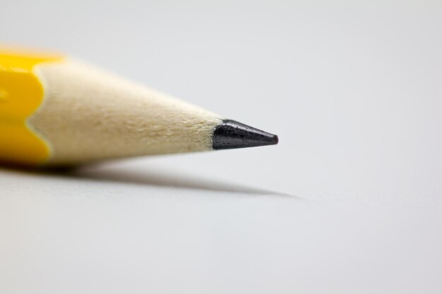 Close-up of pencil over white background