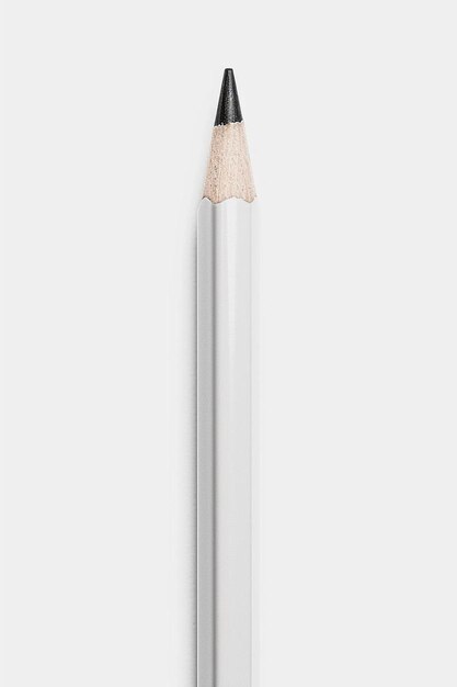 a close up of a pencil on a white surface