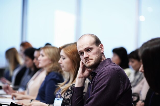 Photo close up.pensive businessman during a press conference