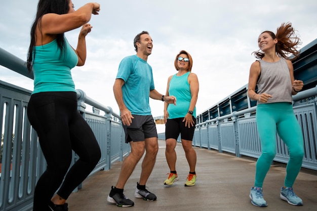 Premium Photo | Close up people doing sport together