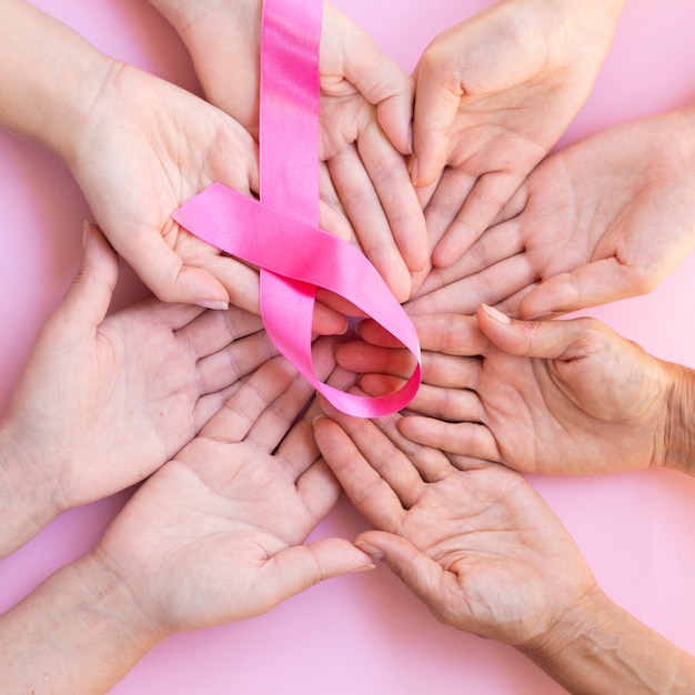 Close-up people expressing solidarity for breast cancer