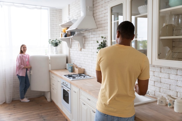 Photo close up on people making home comfortable