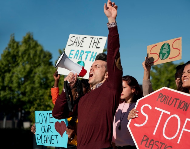 Close up people protesting to save planet