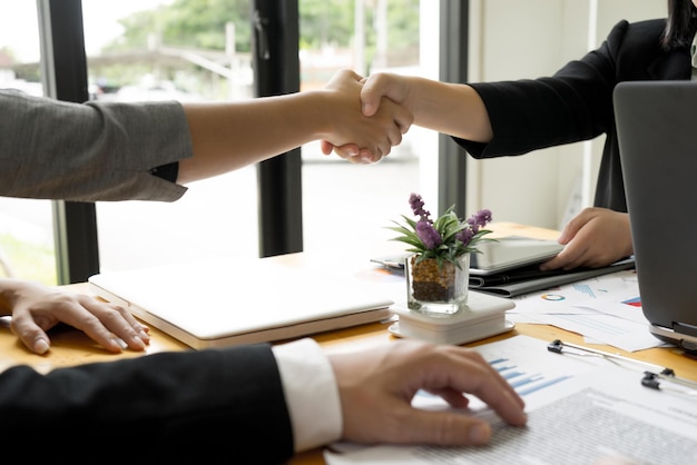 close-up of people shaking hands