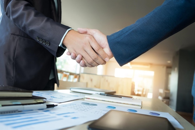 Close-up of people shaking hands