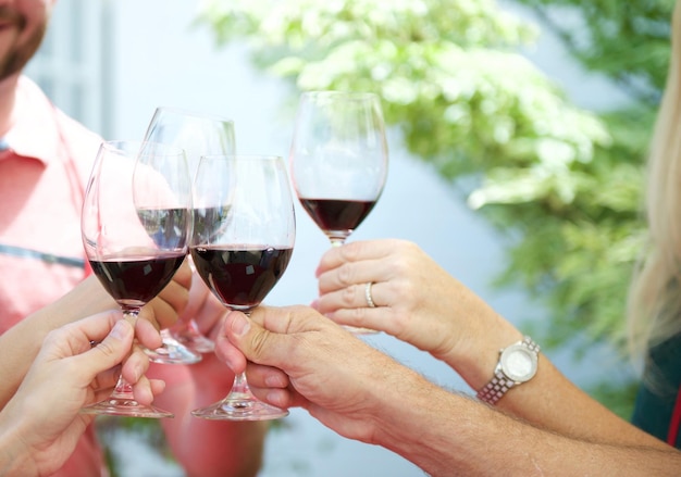 Close-up of people toasting drinks