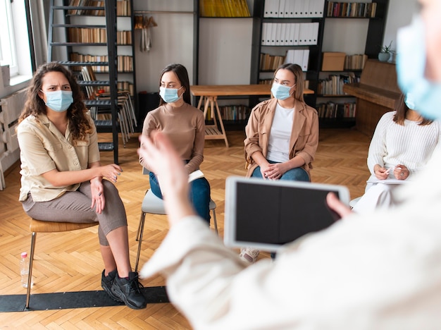 Photo close up people with masks at therapy