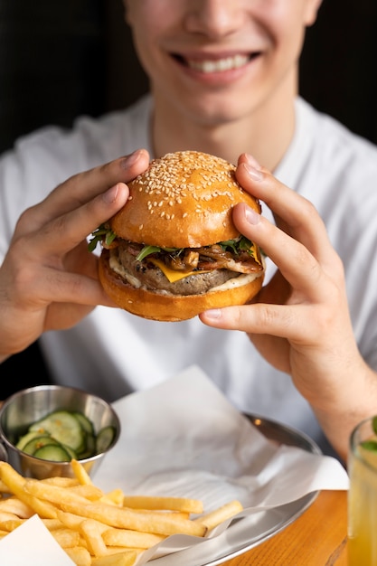 Photo close up on person enjoying food