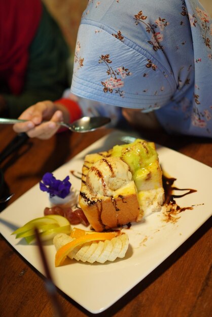 Close-up of person having breakfast served on table