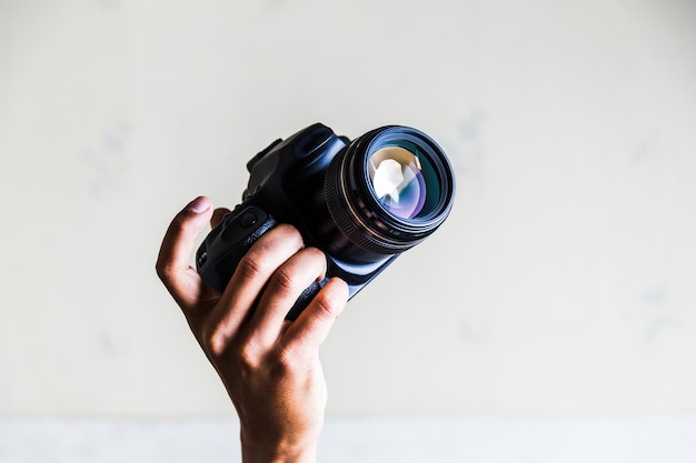 close-up of person holding camera