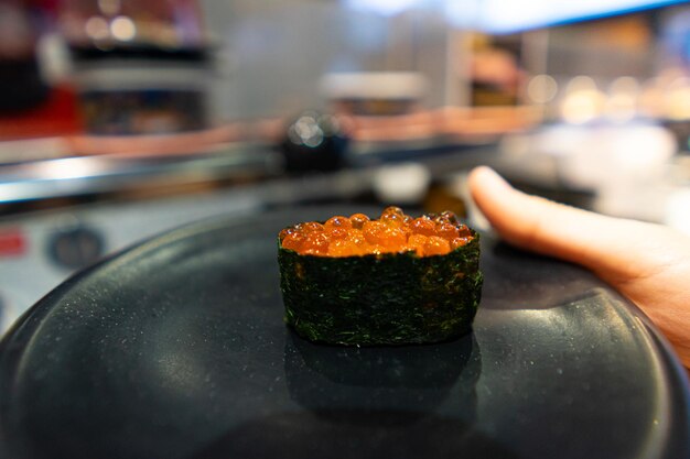 Photo close-up of person holding food in plate