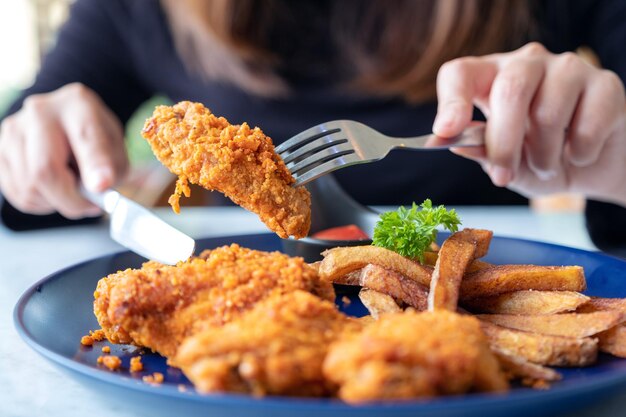 Close-up of person holding food in plate