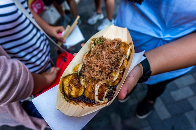 Photo close-up of person holding food