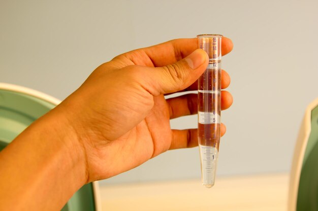 Close-up of person holding glass