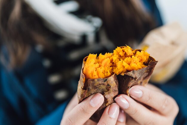 Photo close-up of person holding ice cream