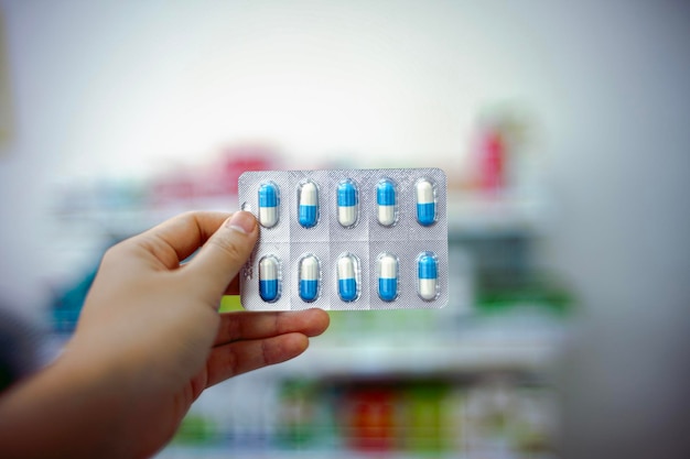 close-up of person holding medicine