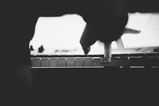 Photo close-up of person playing piano