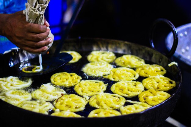 Close-up of person preparing food in kitchen