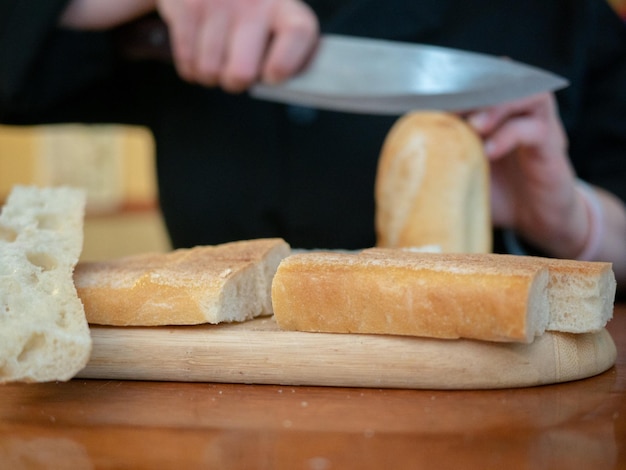 close-up of person preparing food on table