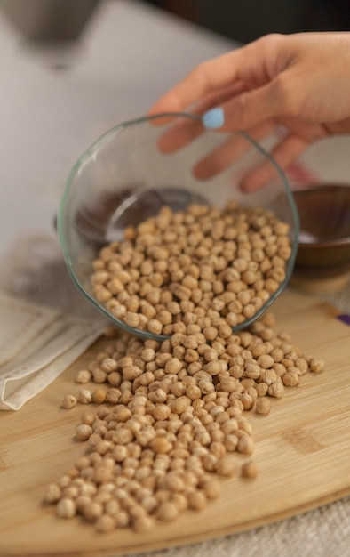 close-up of person preparing food on table