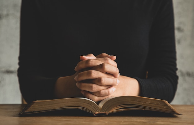 close up on person reading the bible