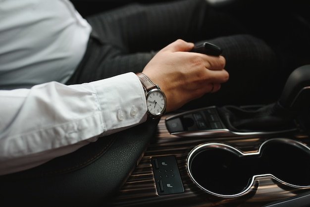 Close-up Of Person's Hand Changing Gear While Driving Car