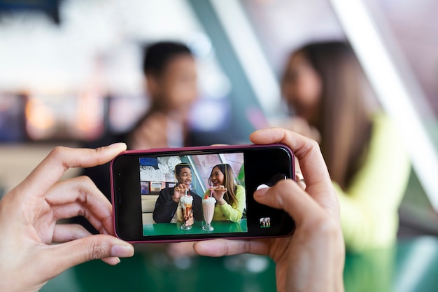 Photo close up on person taking photo of food