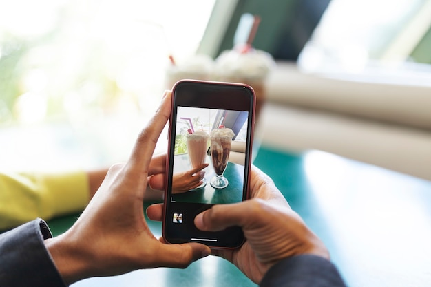 Close up on person taking photo of food