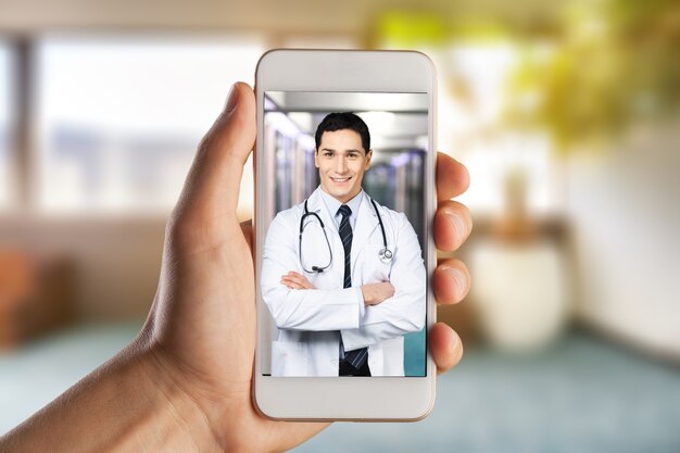 Photo close-up of a person video conferencing with doctor