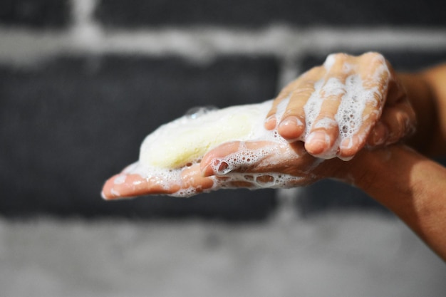Photo close-up of person washing hands