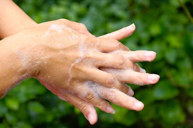 Close-up of person washing hands