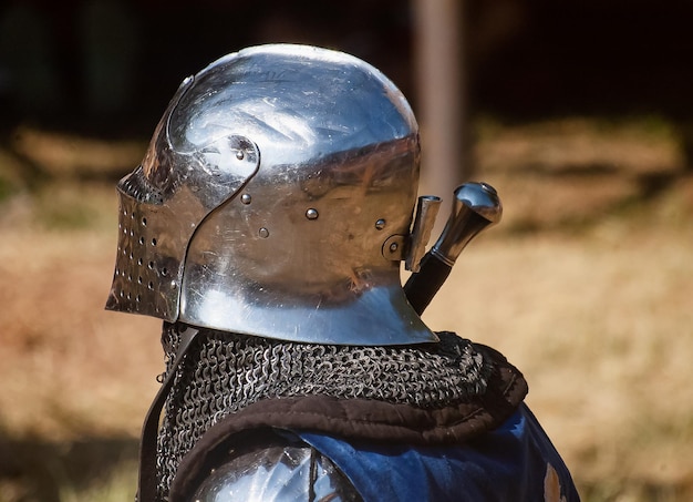Photo close-up of person wearing suit of armor