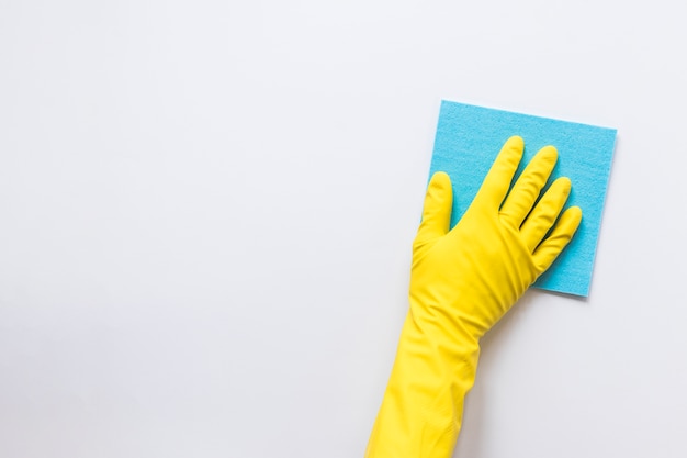 Photo close-up person with glove wiping surface