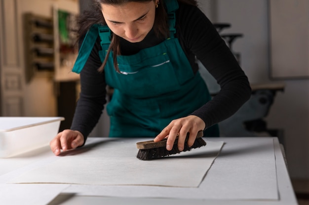 Photo close up on person working on engraving