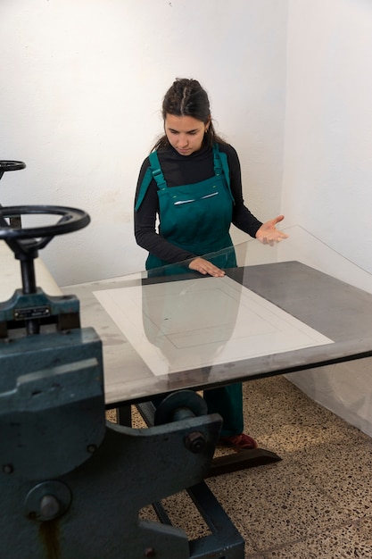close up on person working on engraving
