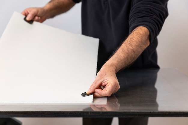 Photo close up on person working on engraving