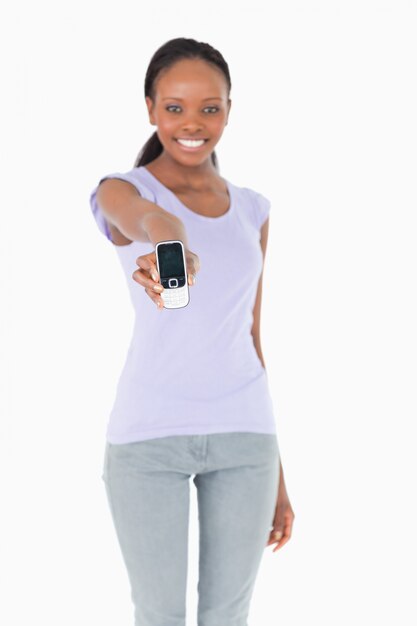 Close up of phone being presented by woman on white background