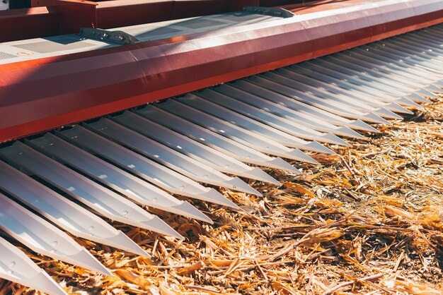 Close up photo of an agricultural equipment machinery on farm land.