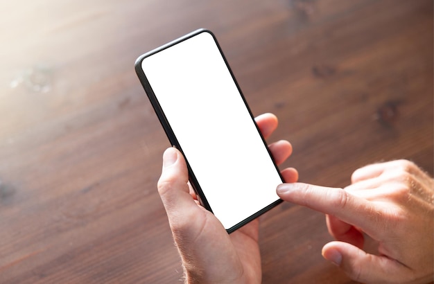 Close up photo of cell phone used by man empty white screen\
mockup