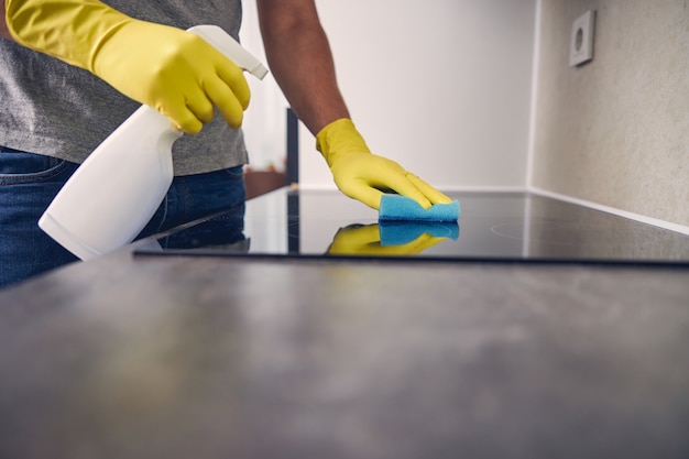 Premium Photo  Closeup of housekeeper holding modern washing