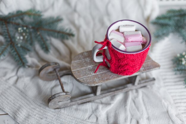 Close up photo of coffee cappucino on wooden background with christmas decorations