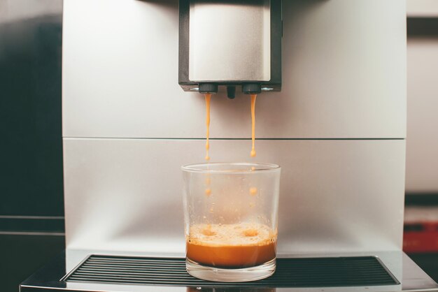 Close up photo of coffee machine making an espresso coffee