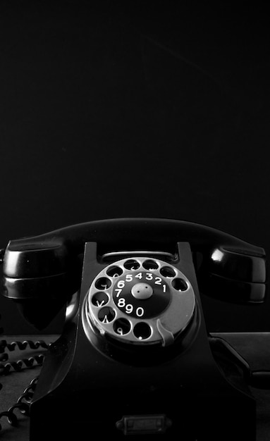 Close up photo from an old fashioned black telephone