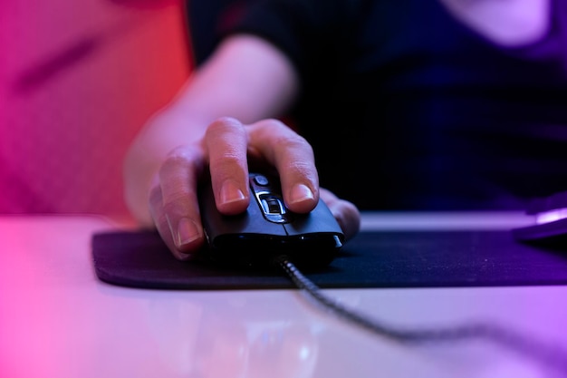 Premium Photo  Gamer playing online game on pc in dark room.