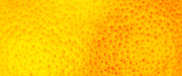 Foto ravvicinata della buccia di pompelmo texture sfondo di frutta matura esotica vista macro xahuman problema della pelle concetto acne e cellulite bella natura sfondo