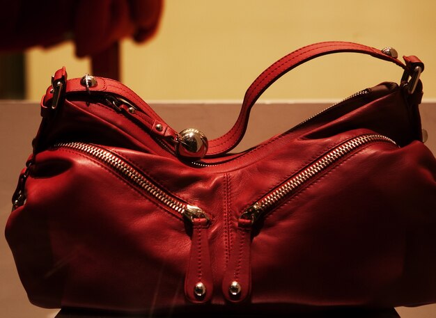 Close-up photo of a handbag exposed in a shop-window