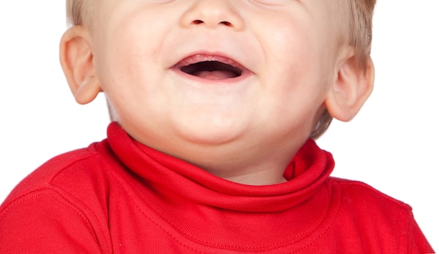 Close up photo of hapy 6 months old baby mouth. Bare gums without teeth.