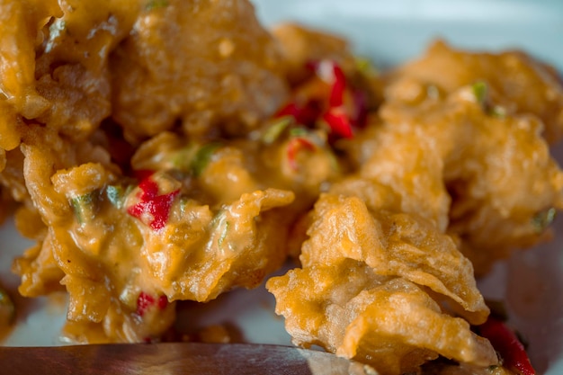 Close up photo main course traditional restaurant Semarang (Chicken fried salted egg)