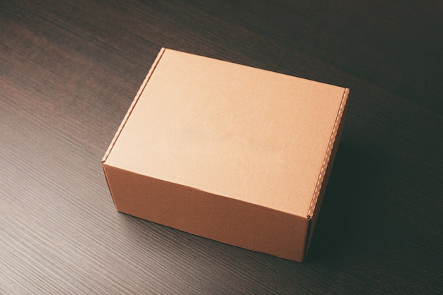 Close up photo of mock up lunch box over dark wooden table