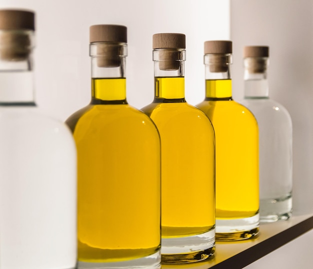 Close-up photo of olive oil bottles on shelf